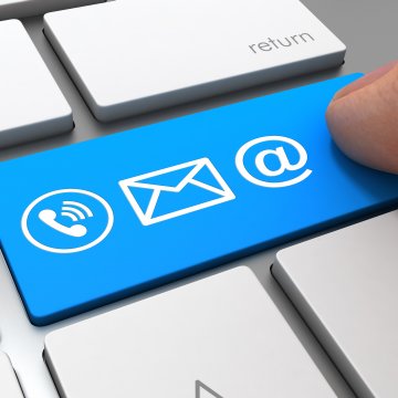 online fax services 2019 best ringcentral finger presiing on blue key on computer keyboard blue key with phone call mail and @ symbols on it